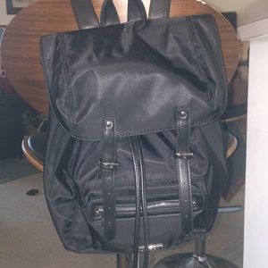 Madden Girl black backpack.